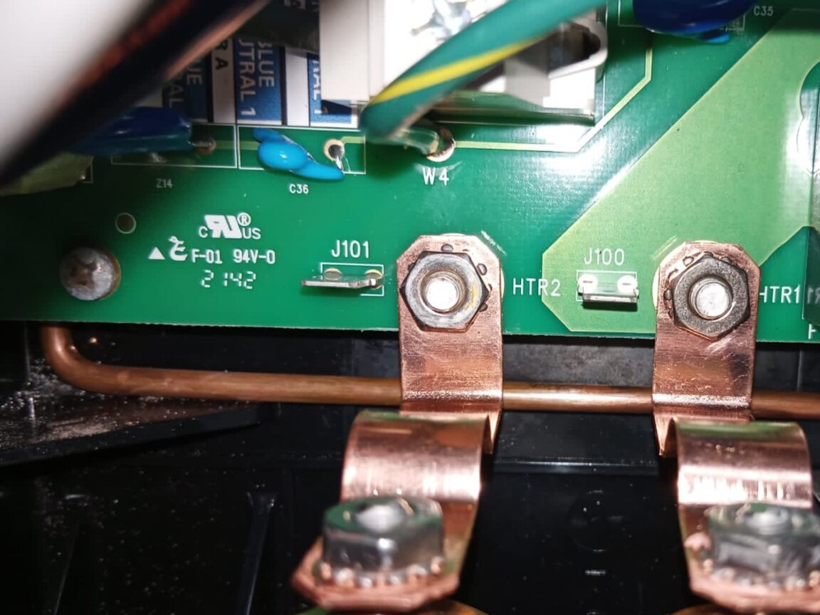 New copper heater straps fitted between a hot-tub heater assembly and replacement circuit board